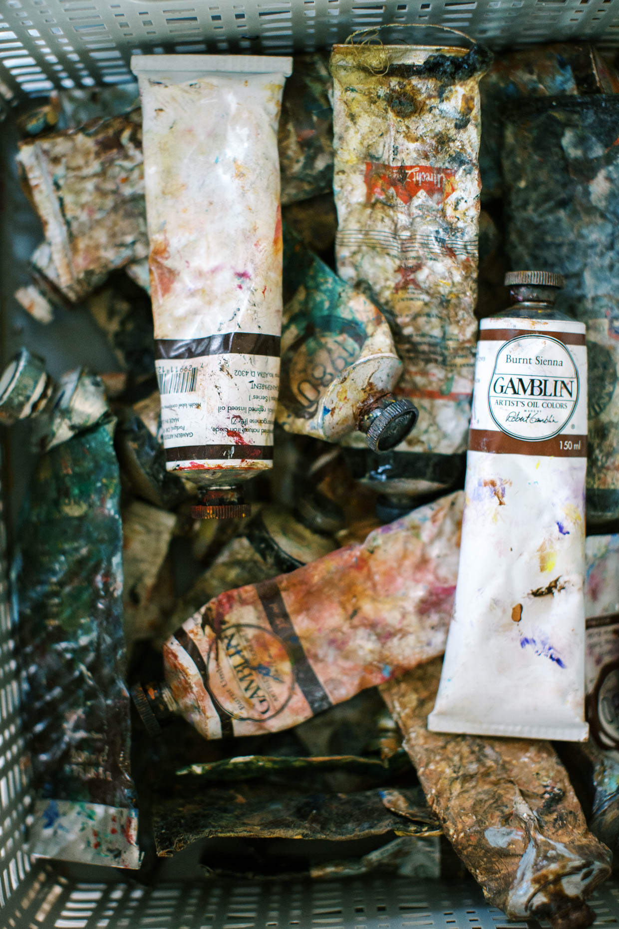 Worn and used paint tubes in an artists studio
