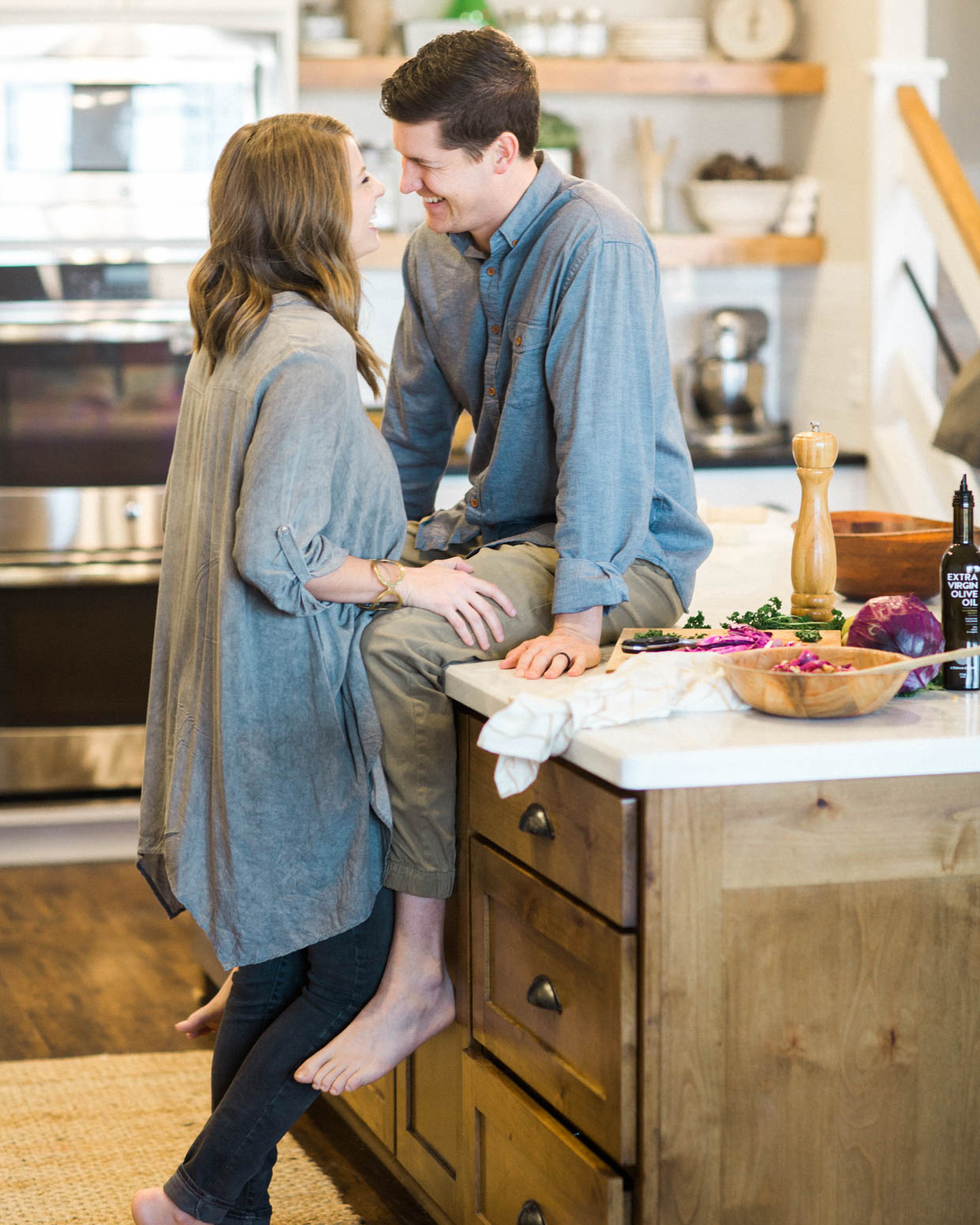 couple being playful in the kitchen together