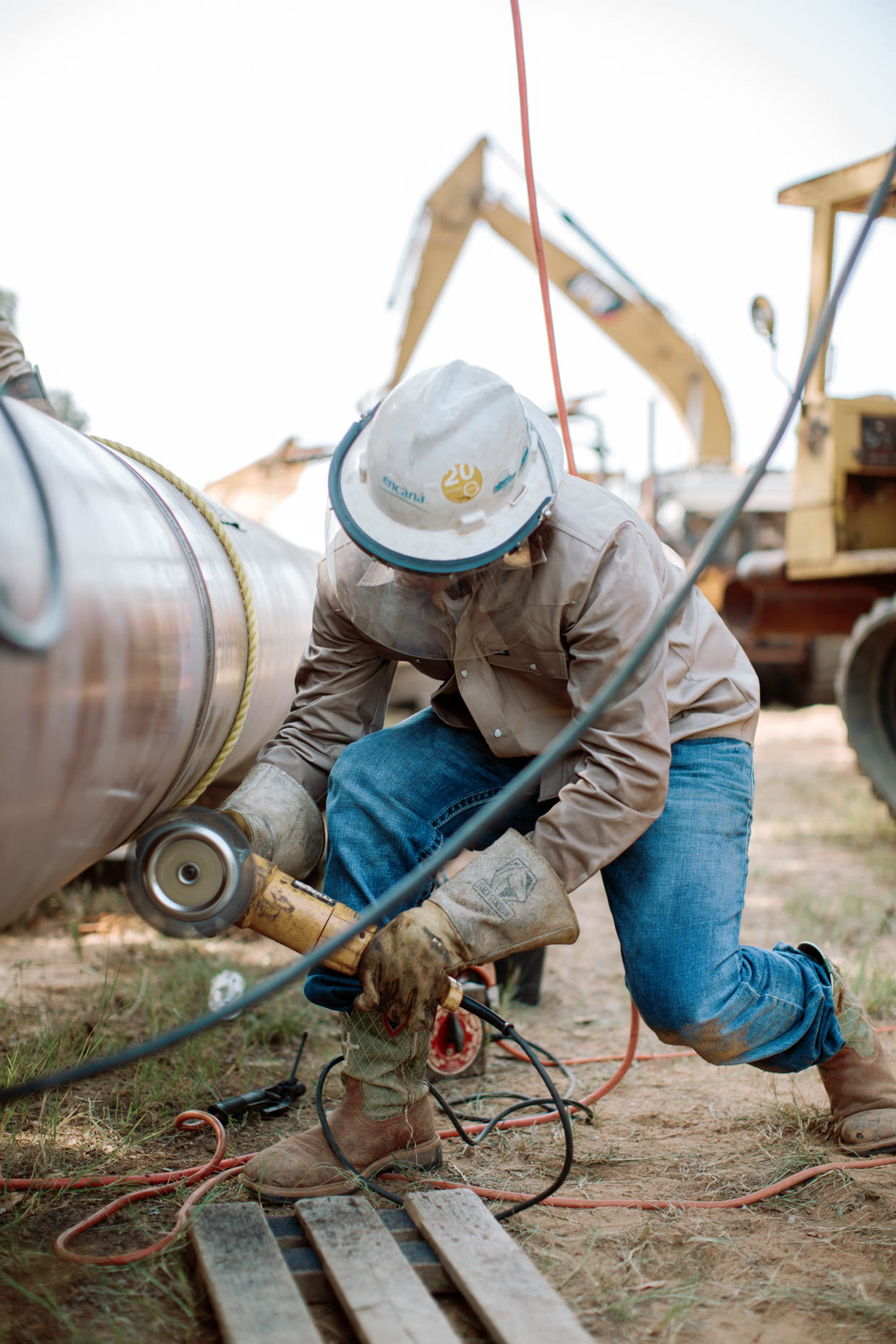 welder working on site commercial photography for oil and gas pipeline company