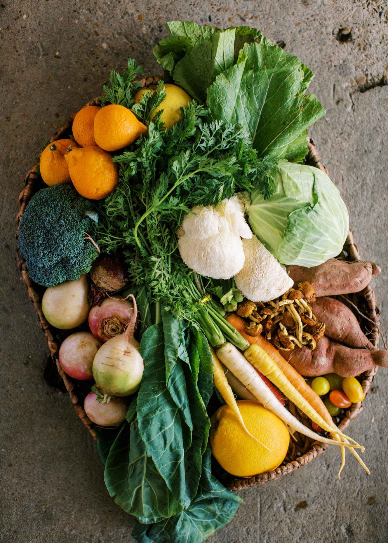 Flatlay view photo of a CSA basket of fresh unique organic produce for local farm brand photography 
