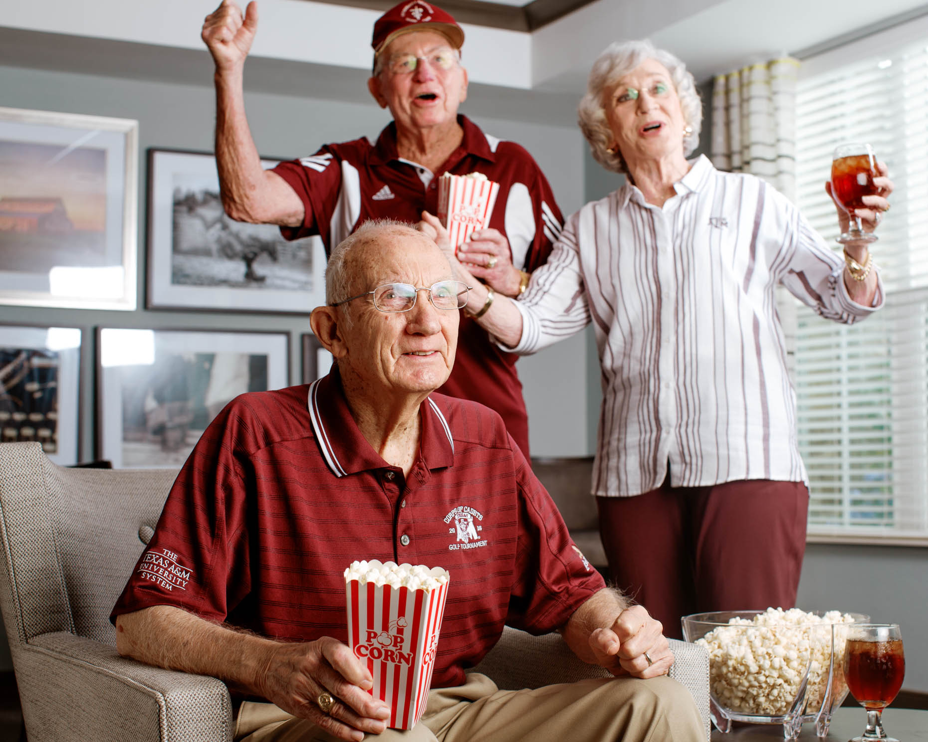 Retirees watching Aggie football game at a senior living community