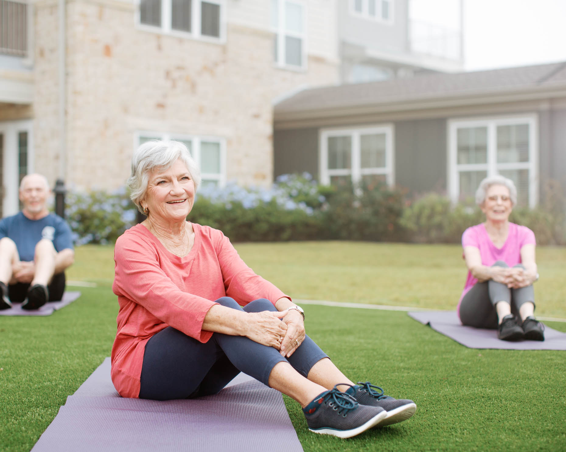 Outdoor fitness yoga class at a senior living retirement community