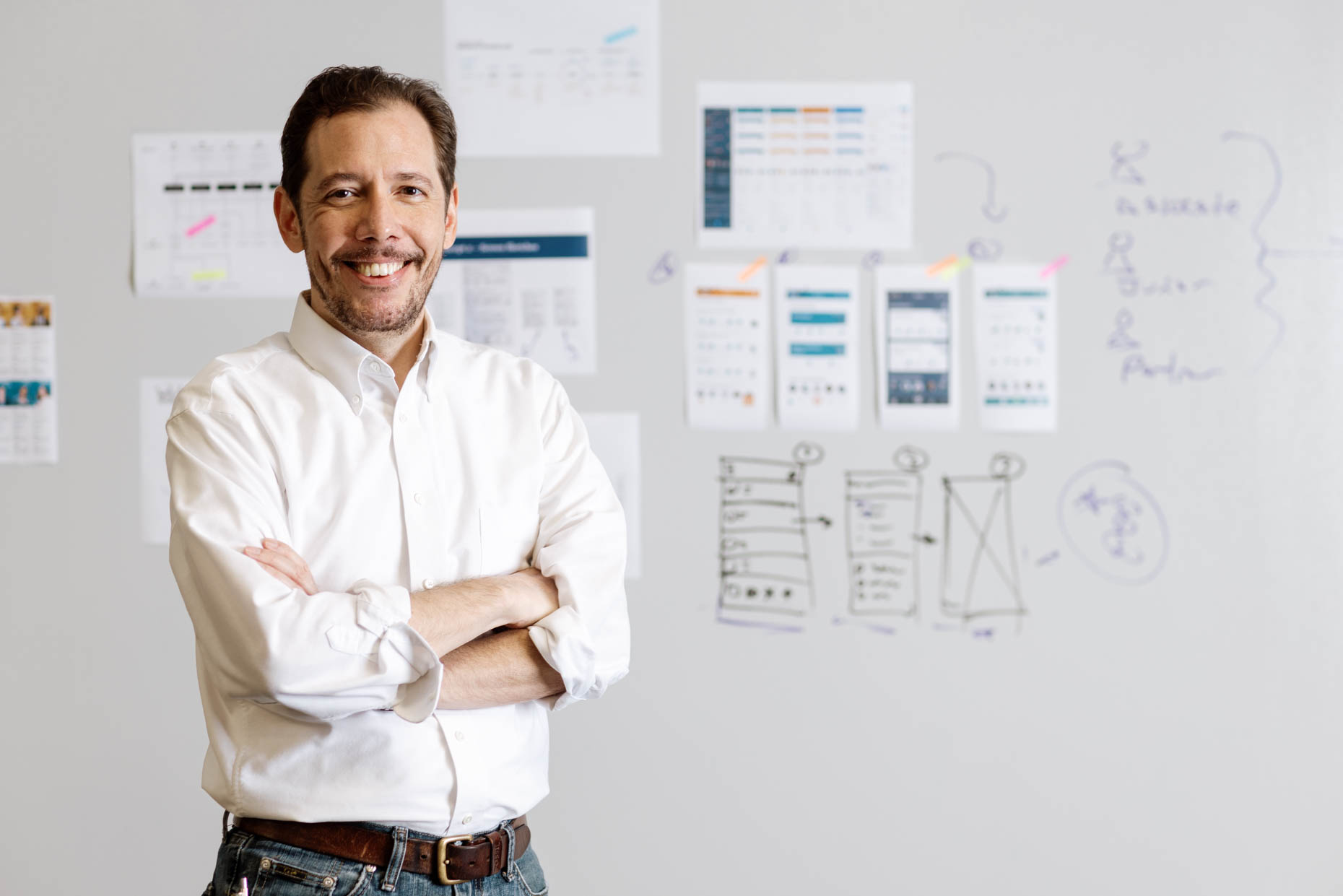 Portrait of a male professional in a software company standing in front of a strategy white board 